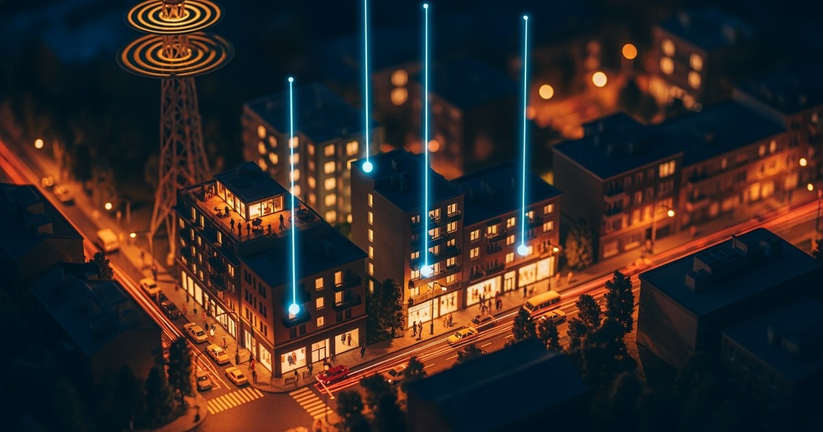 A tilt-shift macro photograph of a miniature city model at twilight, where tiny buildings emit vertical beams of cyan light representing