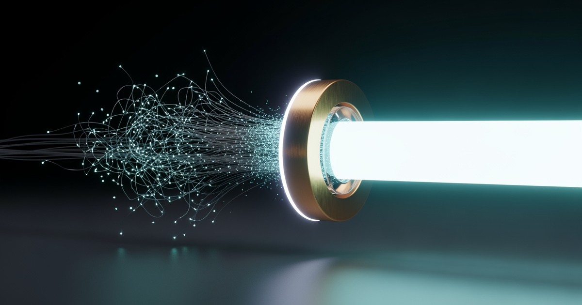 A surreal 3D closeup of loose, glowing optical fibers being pulled through a gold ring and fusing into a single powerful beam of light.