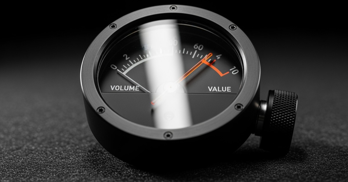A close-up of a sleek, matte-black analog audio meter where an orange needle points to 'VALUE' instead of 'VOLUME,' symbolizing quality