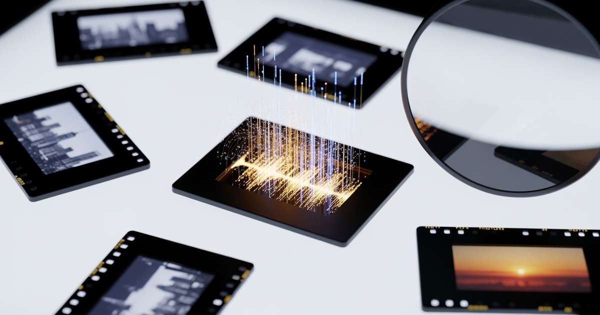 Top-down macro photograph of a film editor's backlit light table featuring 35mm slides, where the center slide holds a glowing digital
