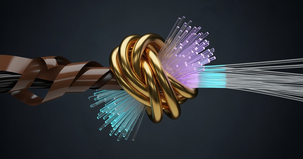 Macro photograph of vintage magnetic tape knotted tightly with glowing fiber-optic cables, fusing into liquid gold at the center.
